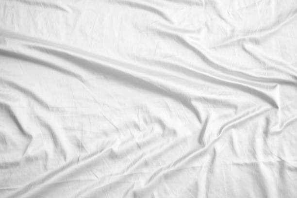 istock Abstract white wrinkled bedding sheet fabric texture background 2161685588
