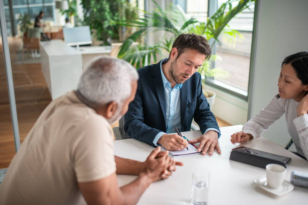 istock Diverse Financial Advisors Meeting with Senior Client 2161685592