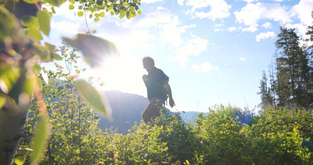 istock Senior man hikes in meadow 2161685732