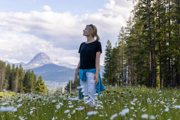 istock Young woman hikes in mountain meadow 2161686379