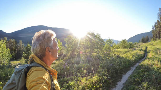 istock Senior man hikes pathway in mountains 2161686485