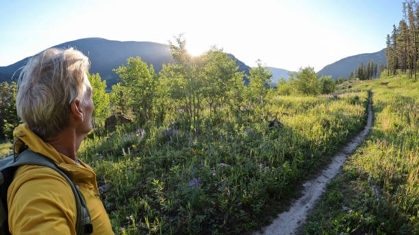 istock Senior man hikes pathway in mountains 2161686488