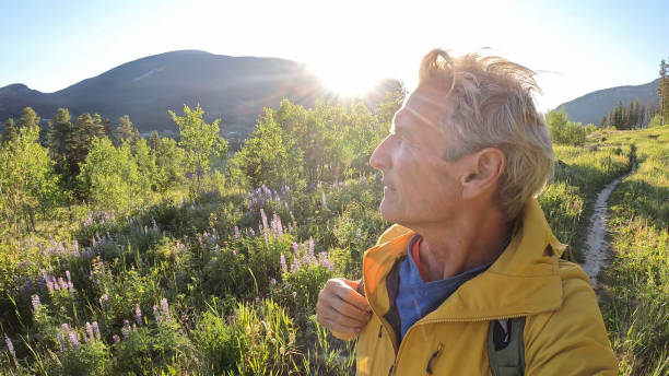 istock Senior man hikes pathway in mountains 2161686519