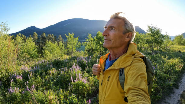 istock Senior man hikes pathway in mountains 2161686522