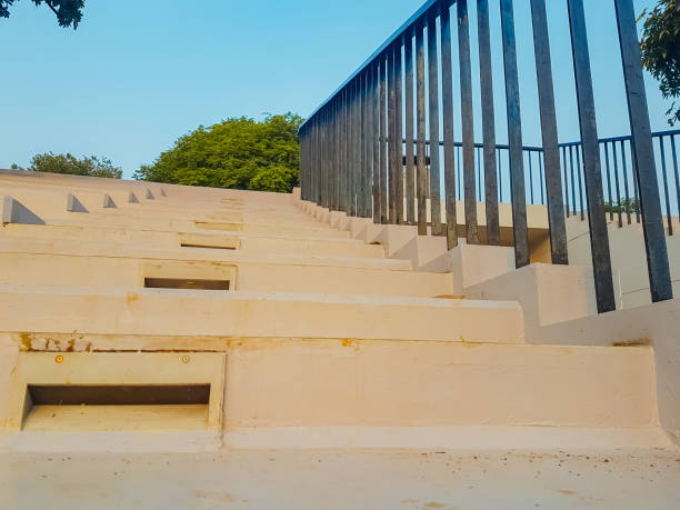 Stone stairs and iron railings, with a blue sky in the background