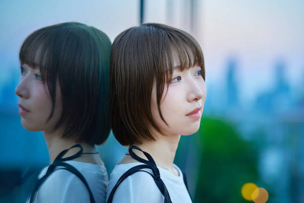 istock a young woman standing in the city during magic hour 2161693331