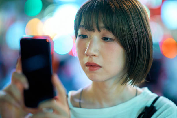 istock A young woman operating a smartphone 2161693445