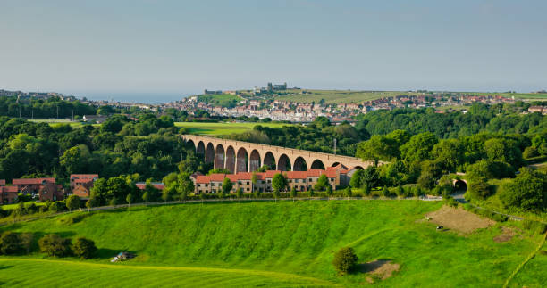 istock Aerial View Across Fields and Old Viaduct Towards Whitby 2161694020