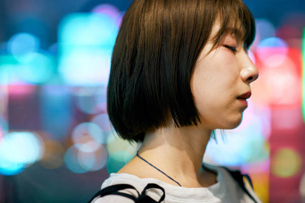 istock A young woman and downtown at night 2161694101