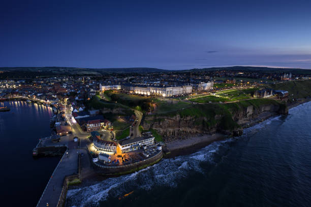 istock High Angle Drone Shot of Whitby at Night 2161694224