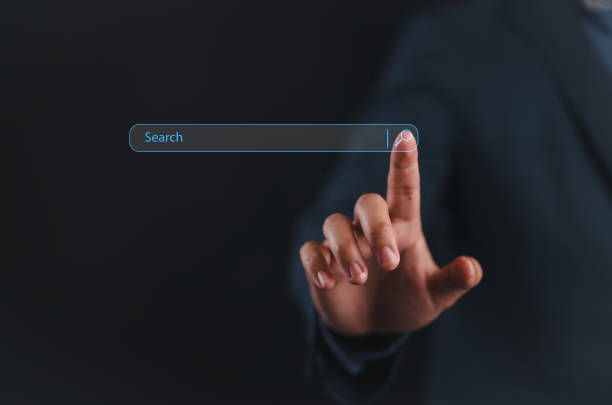 istock man hand touching on search bar for Search Engine Optimization or SEO concept to find information or data by internet connection. internet, network, database, information system. 2161695699