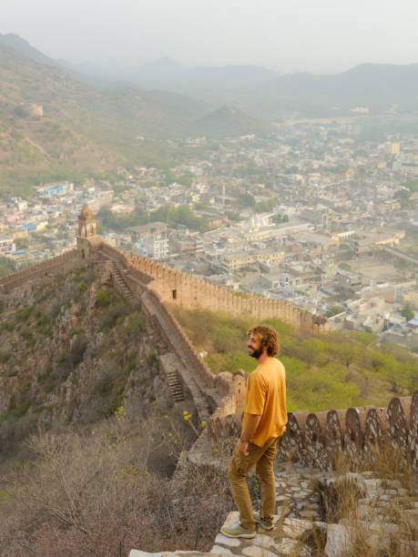 istock Man walking on surrounding wall in Amber, Jaipur looking at view 2161696510