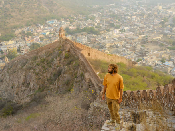 istock Man walking on surrounding wall in Amber, Jaipur looking at view 2161696520