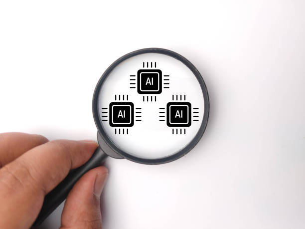 istock AI Insight Amplifying Understanding Through Technological Lens, hand holding magnifying glass with ai icon 2161699563