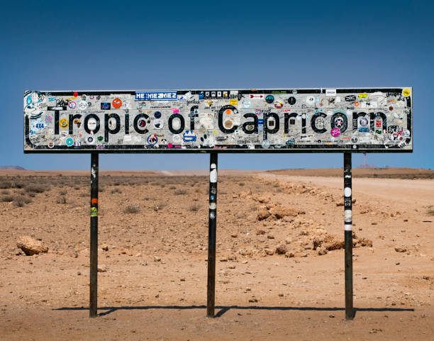 Tropic of Capricorn sign Tropic of Capricorn sign in Namibia tropic of capricorn stock pictures, royalty-free photos & images