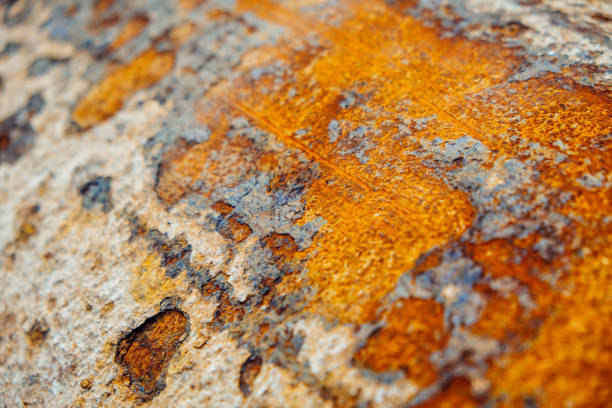 Eroded metallic texture, abstract rusty background. Corrosion spots on metal close-up.