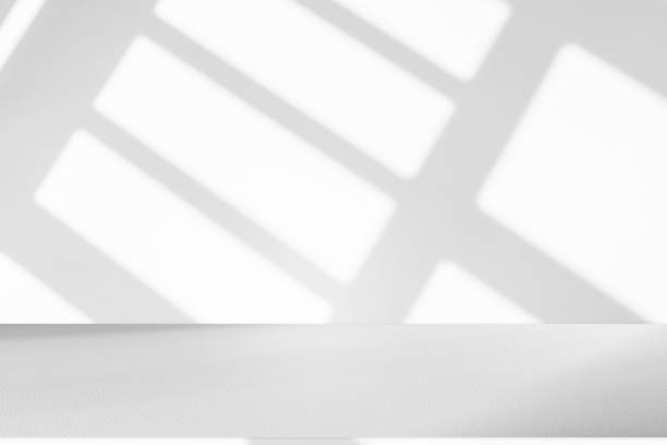 istock Studio-style background wall decoration uses pastel green and white tones. There is a light shadow from the window. Luxurious background decoration ideas 2161712347