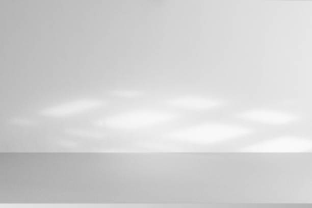 istock Studio-style background wall decoration uses pastel green and white tones. There is a light shadow from the window. Luxurious background decoration ideas 2161712362
