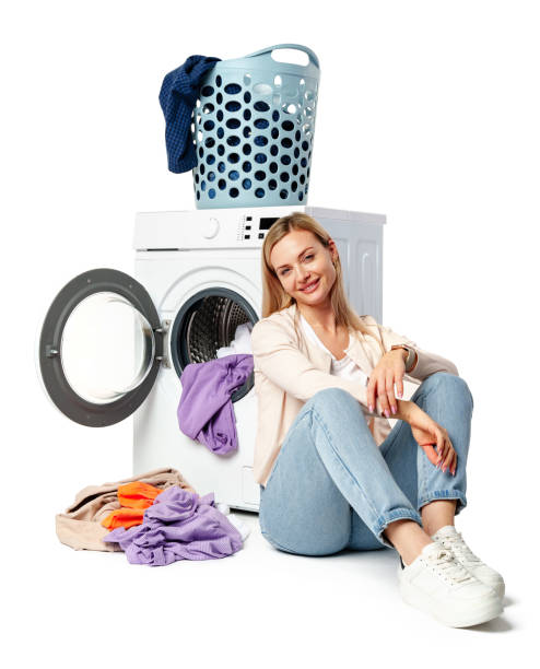 istock Woman Loading Clothes Into White Washing Machine on white background 2161712615