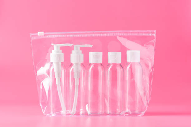 istock Five Clear Plastic Travel Bottles With White Pumps and Caps on Pink Background 2161713608