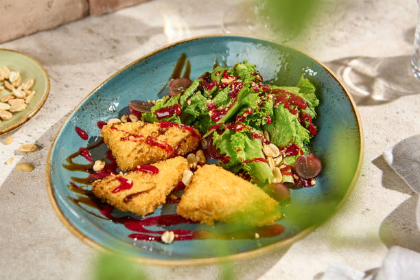 istock Authentic Cheese Tempura Salad with Grapes in Sunlit Still Life Setting 2161717811