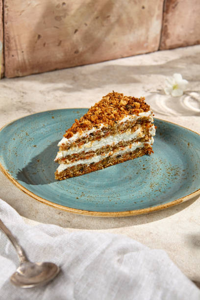 istock Rustic Carrot Cake Slice in Sunlit Still Life with Natural Textures and Shadows 2161717871