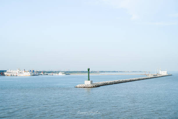 Man made construction in the water in order to protect boats from low waters , in the Dutch part of the Wadden sea