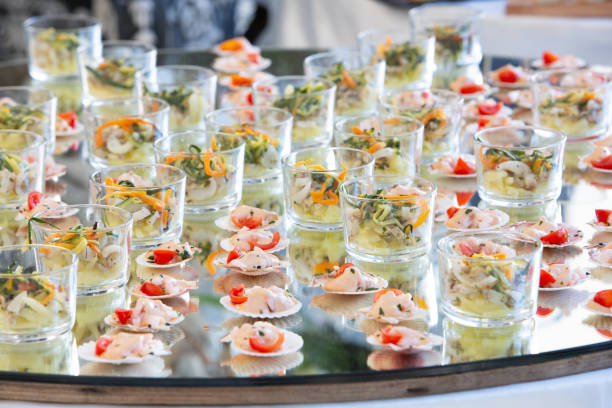 istock Catering service presenting seafood appetizers on mirror tray 2161722040