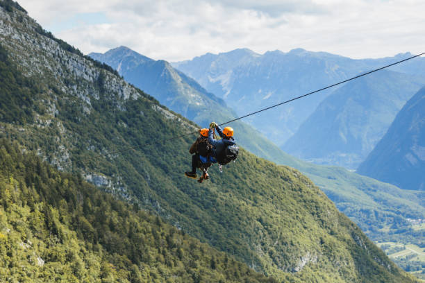 istock Diverse Group Enjoying Zip Line Adventure in Mountain Landscape 2161723983