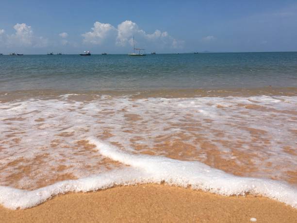 istock Foam and yellow sand beach 2161724209