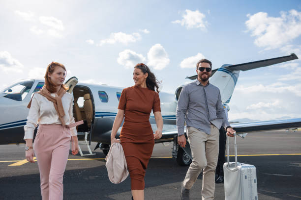 istock Affluent Family Walking Away From Their Private Jet After Vacation 2161728664