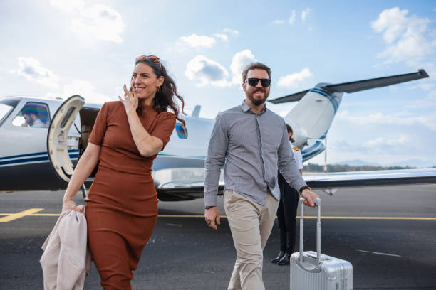 istock Wealthy Couple Exiting Private Jet After Flight 2161728667