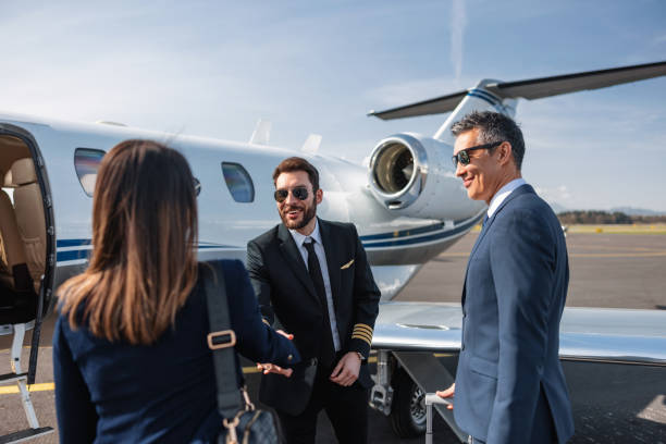istock Business Executives Greeting Each Other by Private Jet 2161728689