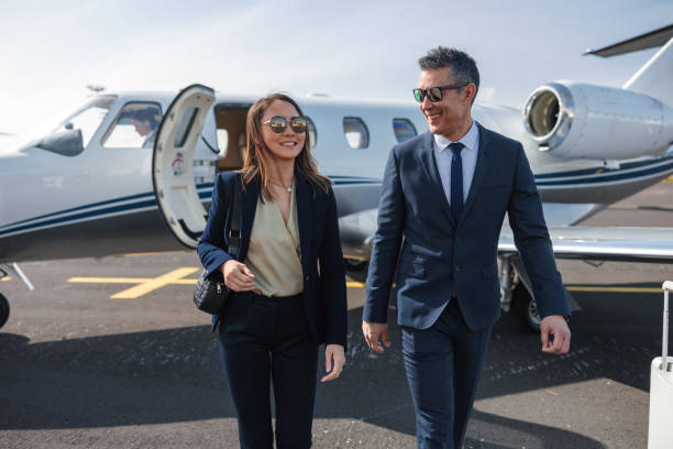 Business Professionals Walking Confidently From Private Jet