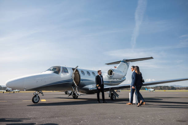 istock Business Executives Approaching Private Jet for Travel 2161728703