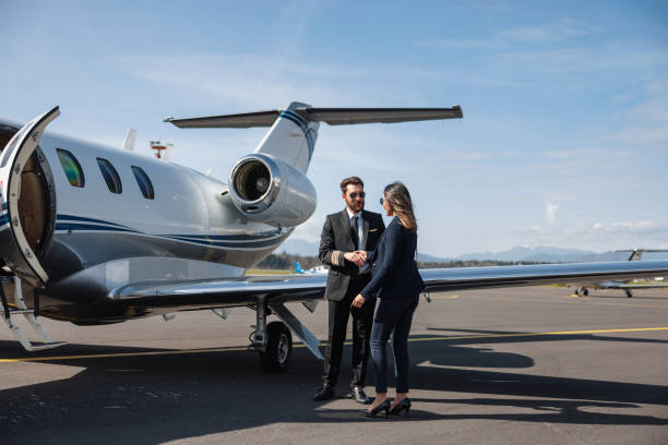 istock Business Professionals Near Private Jet 2161728727