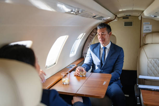 istock Asian Business Executives Toasting in Private Jet 2161728740
