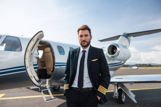 istock Portrait of a Confident Pilot Standing by His Private Jet 2161728770
