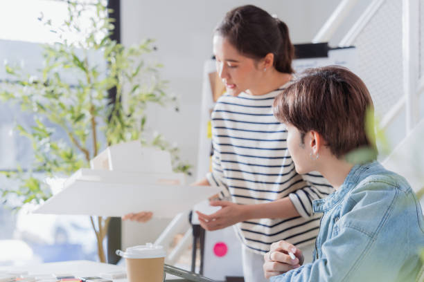 istock Meeting in a modern architectural office asian architect and interior designer working creative space planing design discuss brainstorm ideas sharing together Architect Team working best solution 2161732317