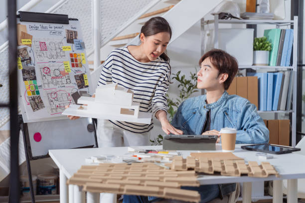 istock Meeting in a modern architectural office asian architect and interior designer working creative space planing design discuss brainstorm ideas sharing together Architect Team working best solution 2161732883