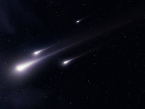 istock Fireballs in space. Meteors on a black background. 2161733296