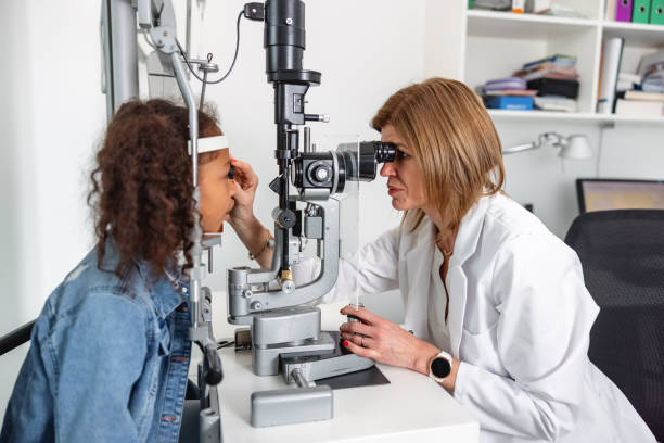 istock Female Optometrist Checking Young Patient Vision 2161734039