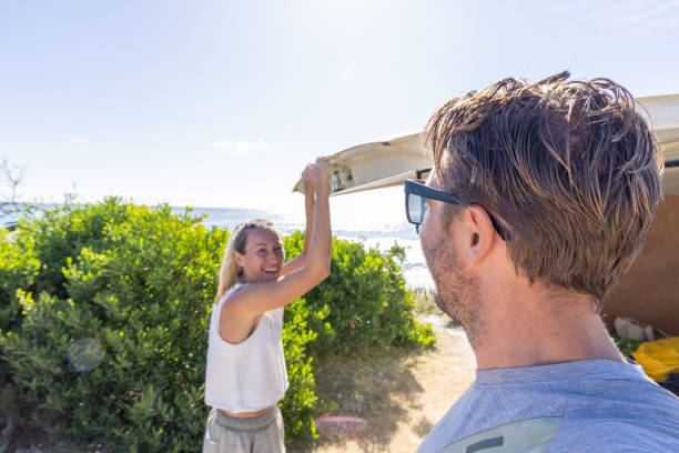 istock Couple Closing Van Trunk by the Beach 2161735885