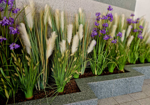 artificial plastic flowers. at a table in a restaurant in a dining room in an arcade in a department store. food court with floral realistic decoration, pennisetum alopecuroides, artificial flower