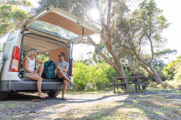 istock Couple Chatting Before Hiking Adventure at Campsite 2161744262