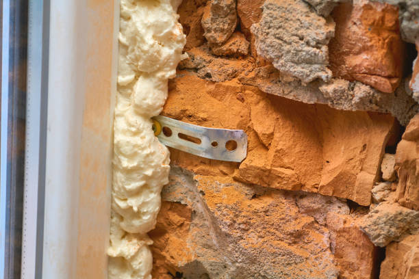 istock Construction foam. Installation of a metal plastic window,door,brick wall. 2161744819