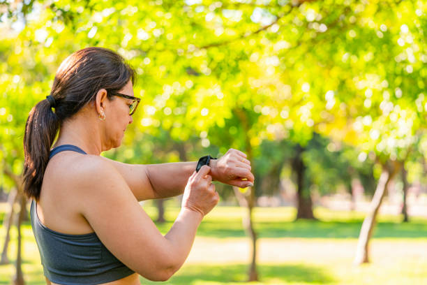 istock Mature woman cheching smartwatch during outdoors training exercises 2161746142