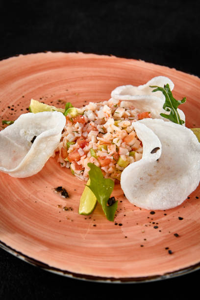 istock Shrimp Tartare with Rice Chips - Gourmet Seafood Dish on Rustic Plate 2161747410