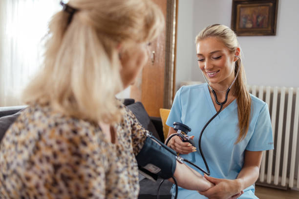 istock Nurse caring for an elderly woman at home 2161747763