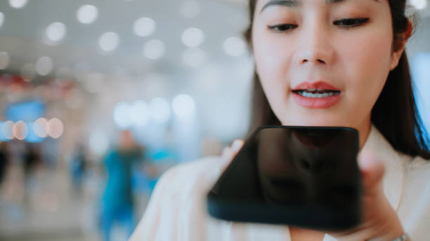 istock Woman Using Ai Voice Assistant on Smartphone. 2161748307
